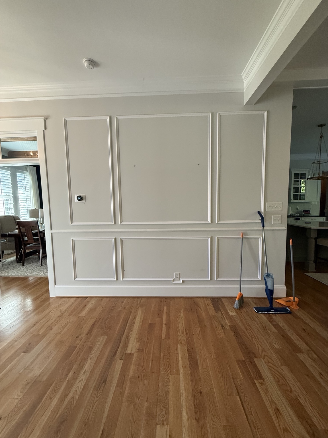 Shadowbox wainscoting above and below the chair rail in a Hallsley foyer in Midlothian, VA