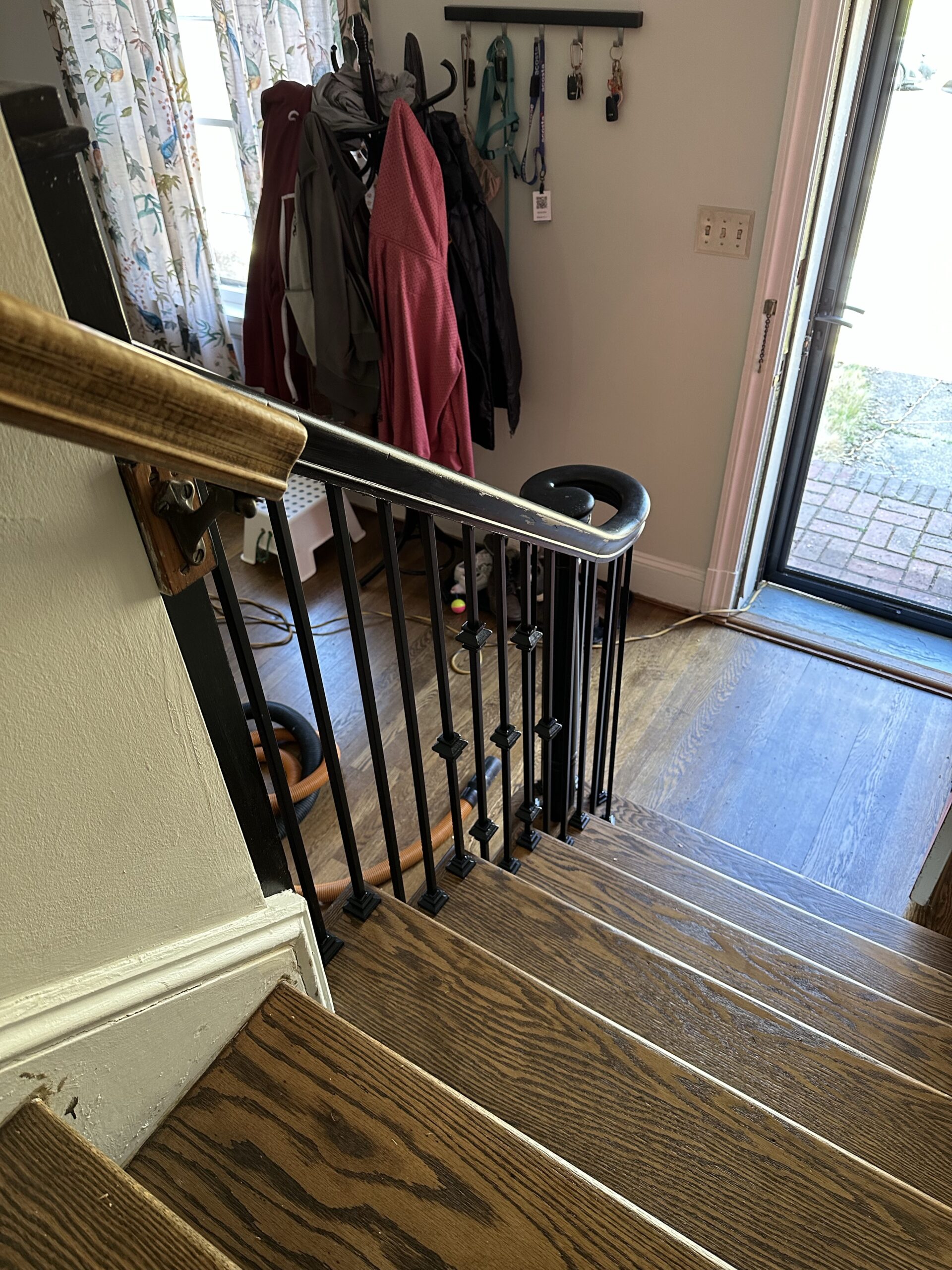 Wood stair pickets replaced with iron balusters